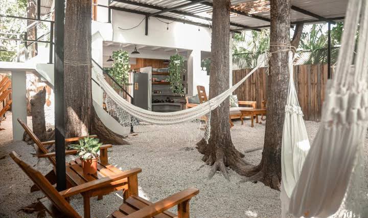 Hammocks and common areas at beachfront house — women's surf retreat Santa Teresa